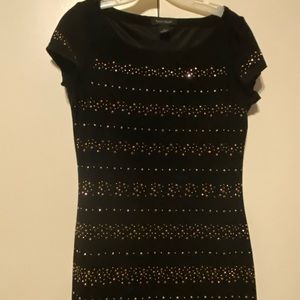 Black dress with gold accents.